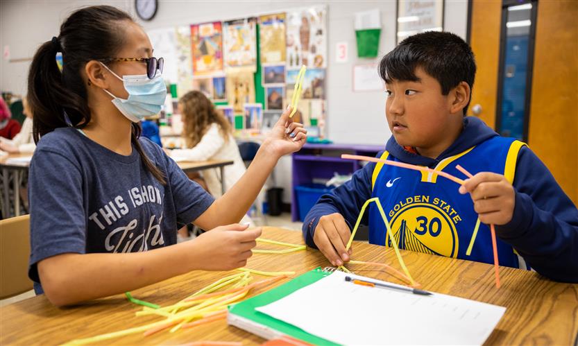 Students make pyramids out of various materials